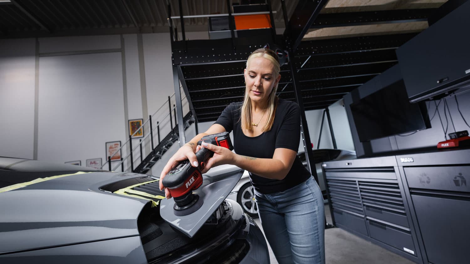 The FLEX PXCE 18-EC being used to polish a section of car paintwork.