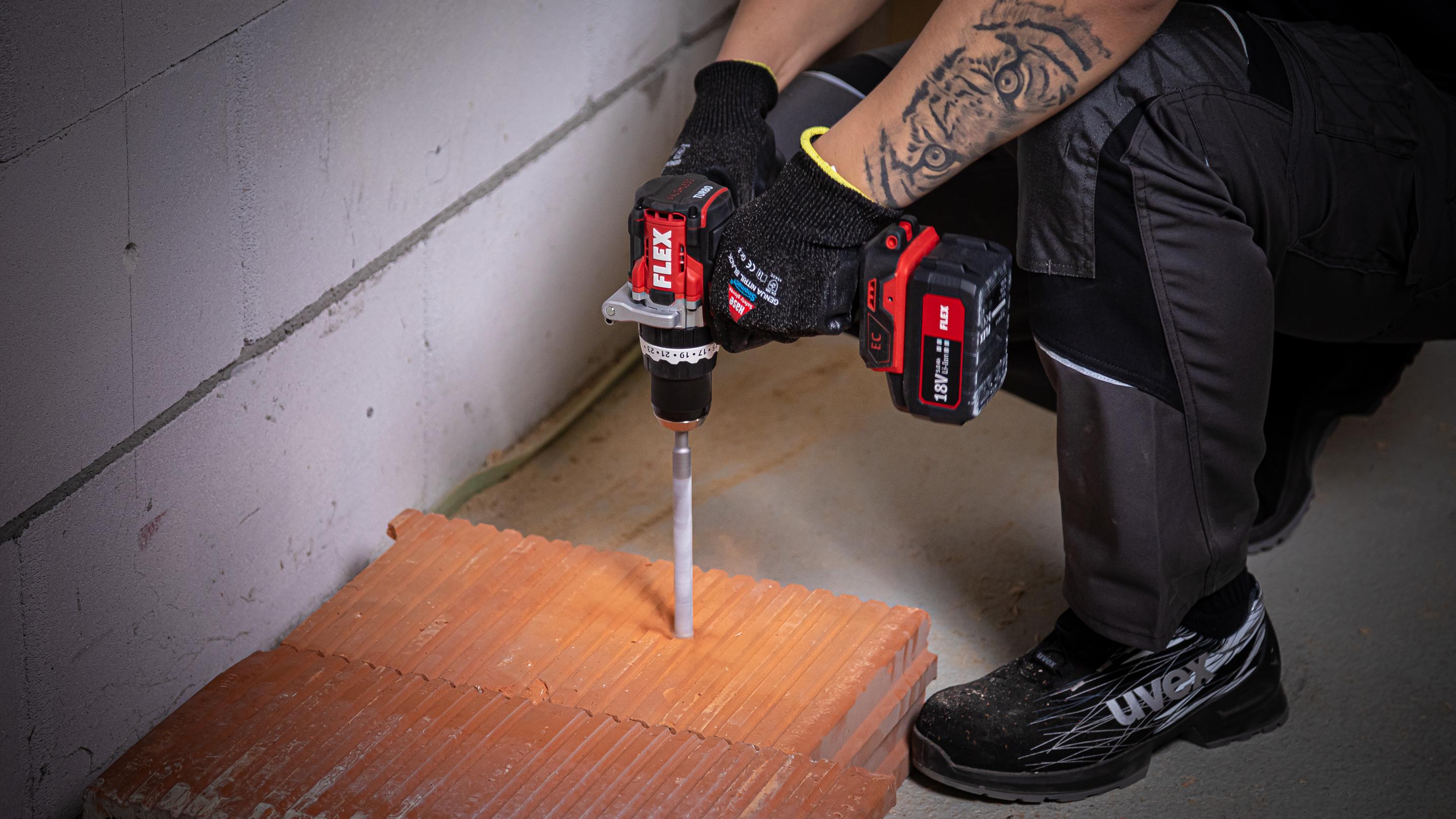 Drilling in brick with FLEX impact drill with turbo mode PD 2G 18.0 HD