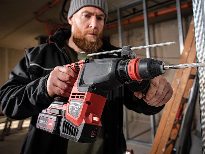 Drilling in a wall with a FLEX cordless rotary hammer drill
